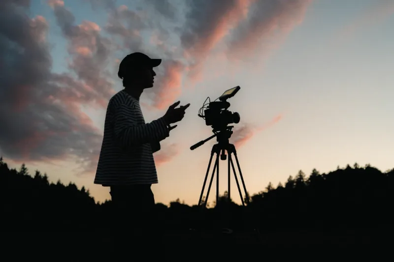 Filmmaker Lua Hell collaborating with the production team on set during a commercial shoot in Switzerland