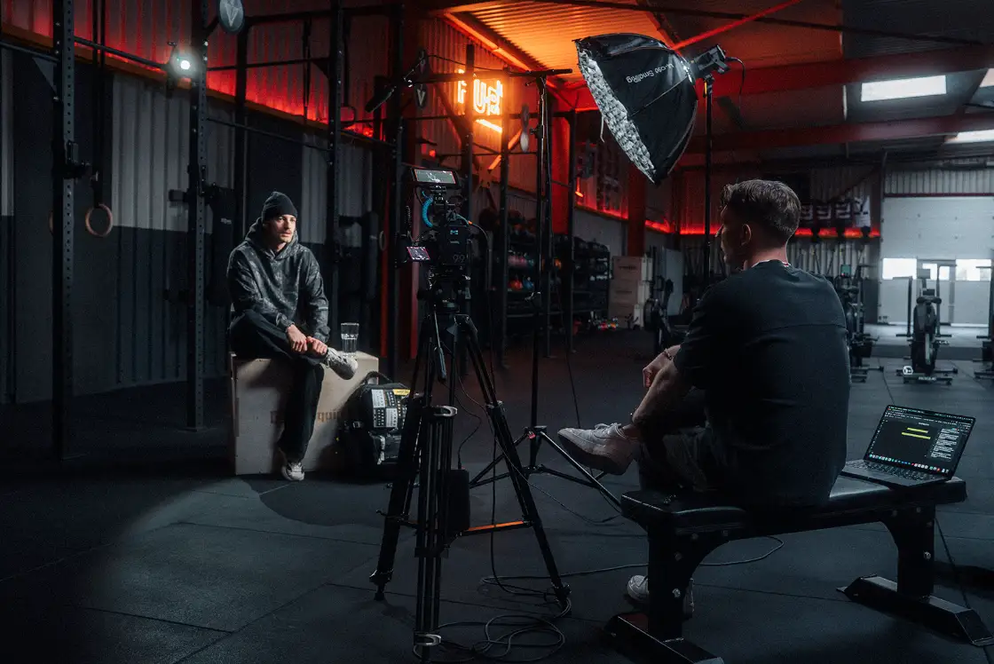 Filmmaker Lua Hell collaborating with the production team on set during a commercial shoot in Switzerland