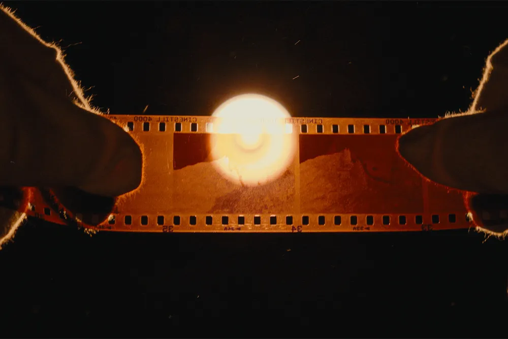 Warm-toned graded frame with analog film texture and halation, produced with the Dehancer plugin and reviewed by filmmaker Lua Hell